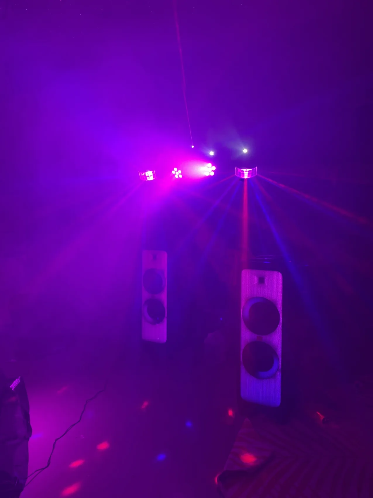 Purple party lights and JBL speakers