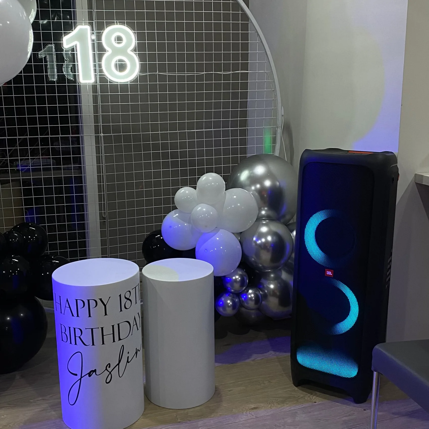 JBL speaker beside birthday decorations